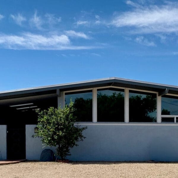 Ralph Haver mid-century modern home in Town and Country Manor Phoenix with clerestory windows, low roofline, integrated garage, and desert landscaping.
