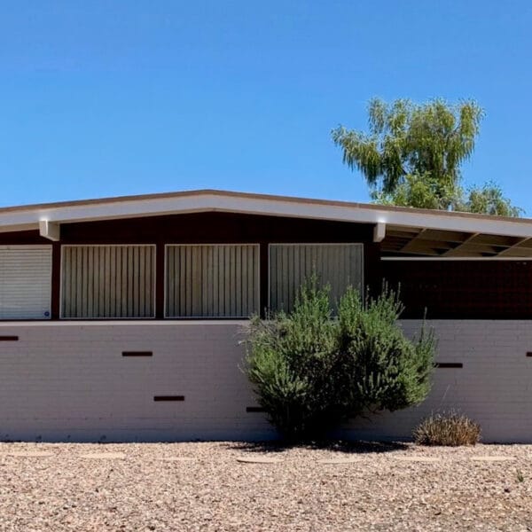 Ralph Haver mid-century modern home in Town and Country Scottsdale with breeze block details, low roofline, carport, desert landscaping, and postwar modern design.