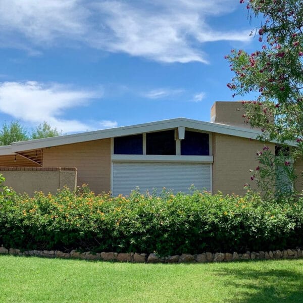Ralph Haver mid-century modern home in Windemere Phoenix with low roofline, clerestory windows, covered patio, lawn, and mature landscaping.